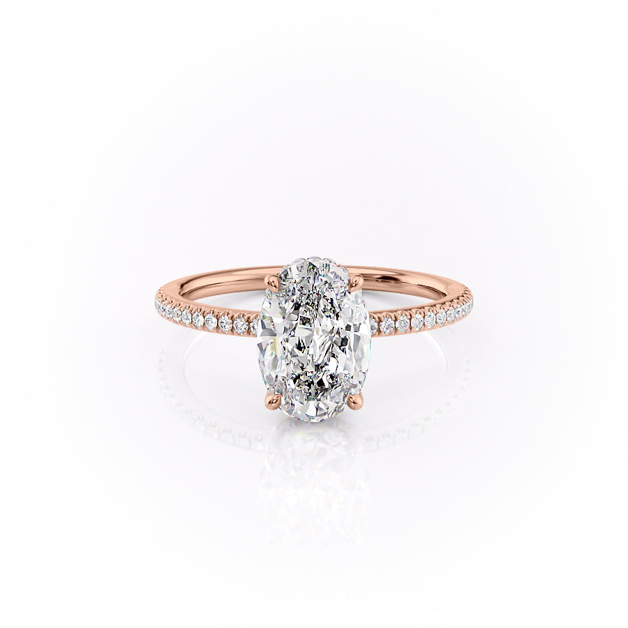 The Pave Margot. A Rose Gold Hidden Halo Engagement Ring Set With A 2ct Oval Lab Grown Diamond. White Background.