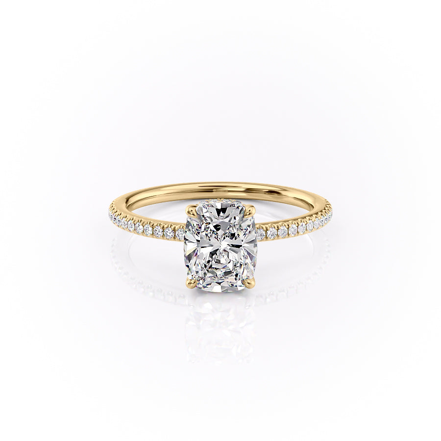 The Pave Margot. A Yellow Gold Hidden Halo Engagement Ring Set With A 2ct Elongated Cushion Lab Grown Diamond. White Background.
