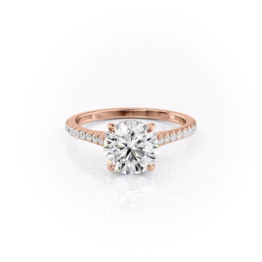 The Pave Natalie. A Rose Gold Hidden Halo Engagement Ring Set With A 2ct Round Lab Grown Diamond. White Background.
