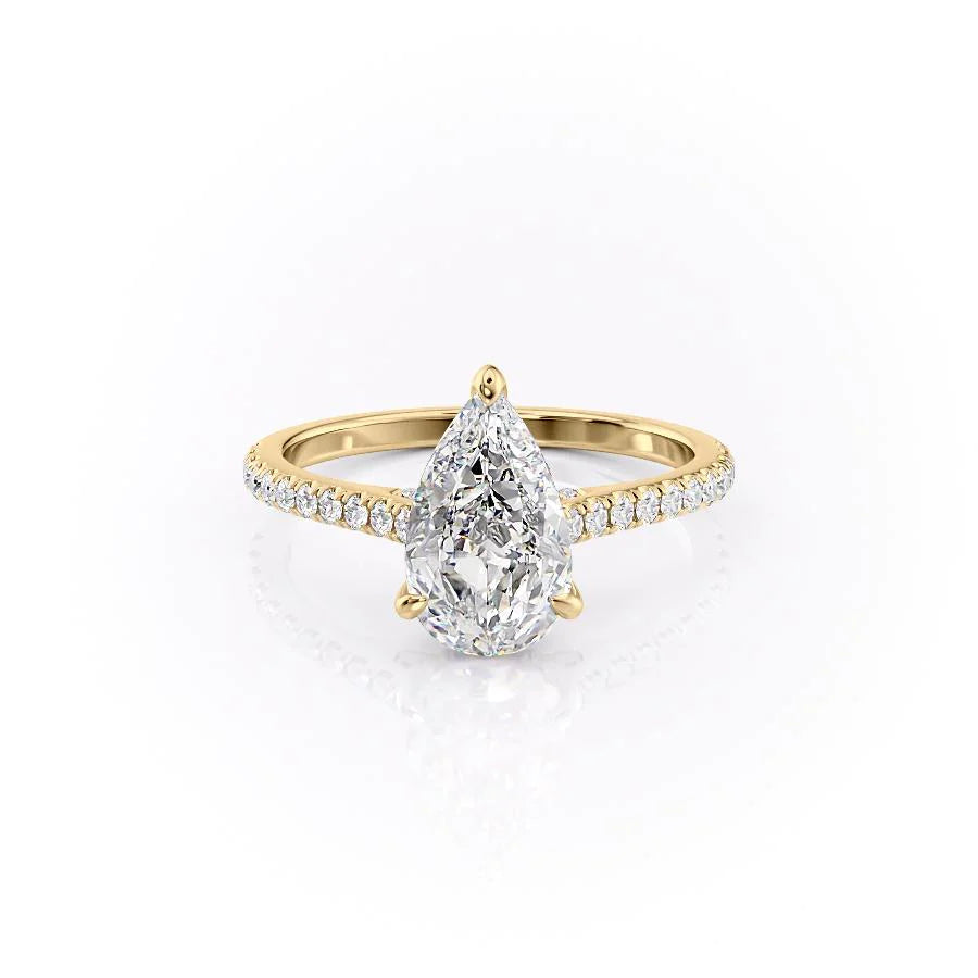 The Pave Natalie. A Yellow Gold Hidden Halo Engagement Ring Set With A 2ct Pear Lab Grown Diamond. White Background.