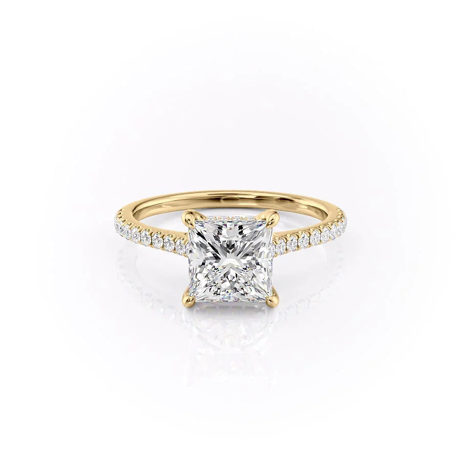 The Pave Natalie. A Yellow Gold Hidden Halo Engagement Ring Set With A 2ct Princess Lab Grown Diamond. White Background.