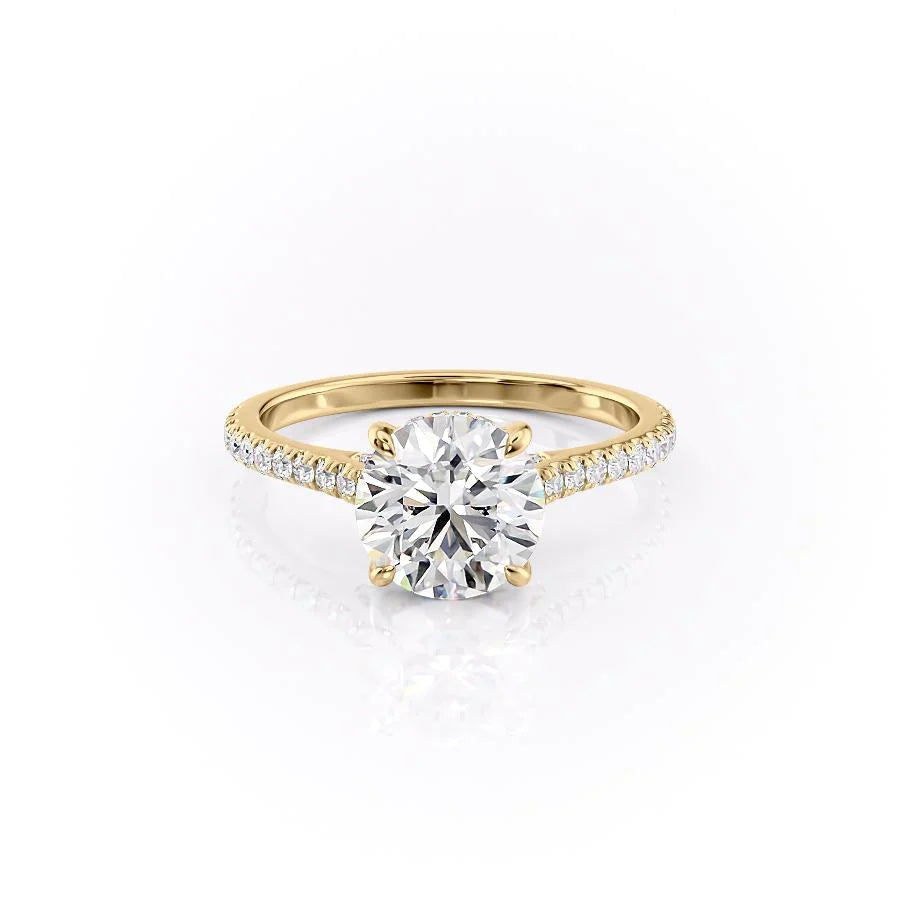 The Pave Natalie. A Yellow Gold Hidden Halo Engagement Ring Set With A 2ct Round Lab Grown Diamond. White Background.