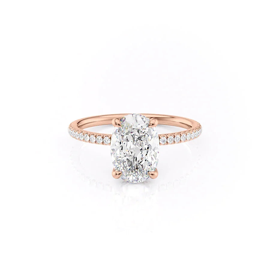 The Pave Nelly. A Rose Gold Hidden Halo Engagement Ring Set With A 2ct Oval Lab Grown Diamond. White Background.