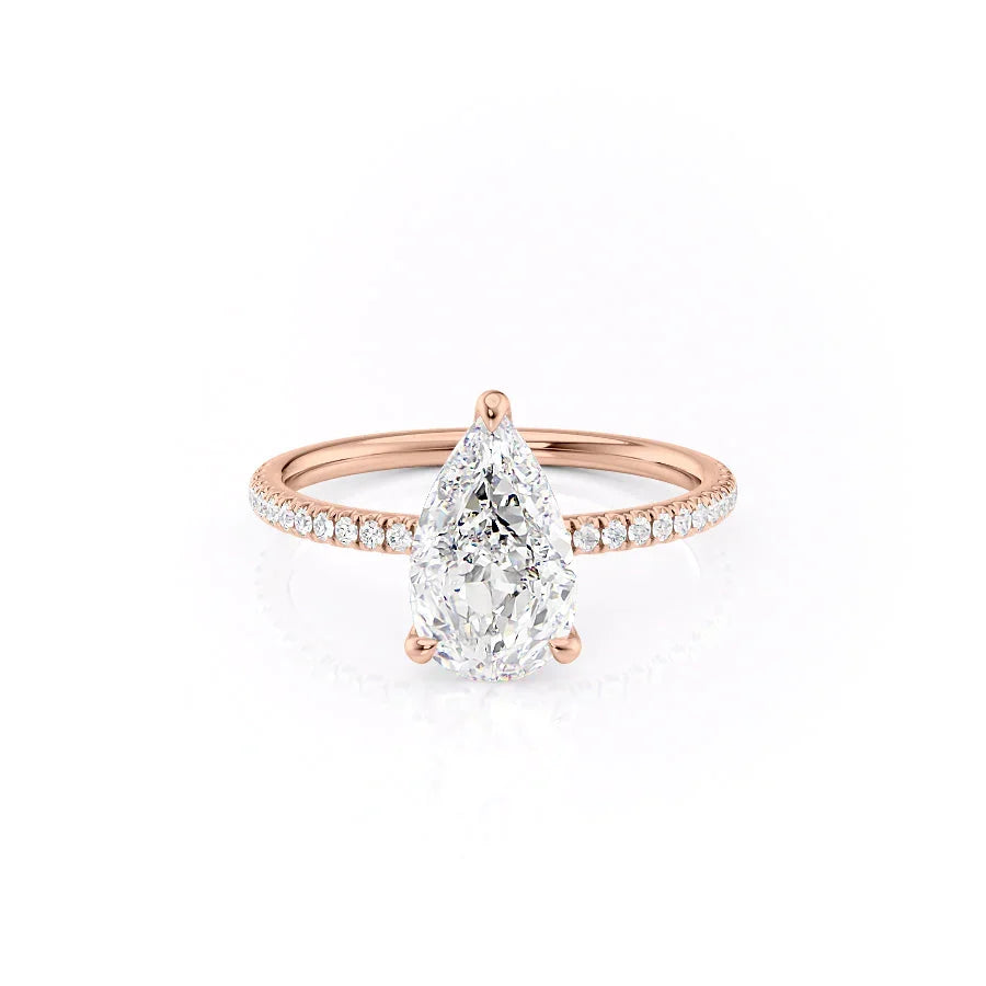 The Pave Nelly. A Rose Gold Hidden Halo Engagement Ring Set With A 2ct Pear Lab Grown Diamond. White Background.
