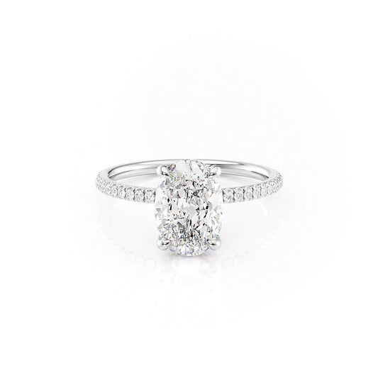 The Pave Nelly. A White Gold Hidden Halo Engagement Ring Set With A 2ct Oval Lab Grown Diamond. White Background.