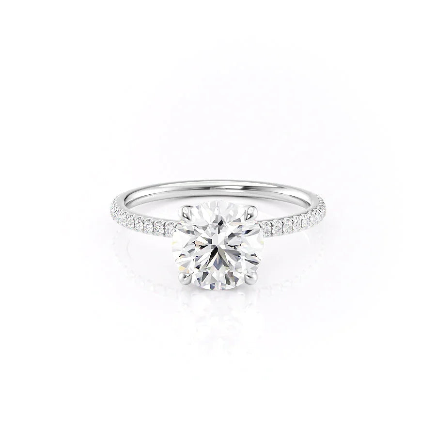 The Pave Nelly. A White Gold Hidden Halo Engagement Ring Set With A 2ct Round Lab Grown Diamond. White Background.