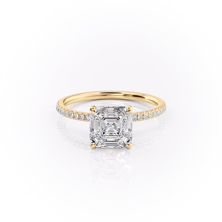 The Pave Nelly. A Yellow Gold Hidden Halo Engagement Ring Set With A 2ct Asscher Lab Grown Diamond. White Background.