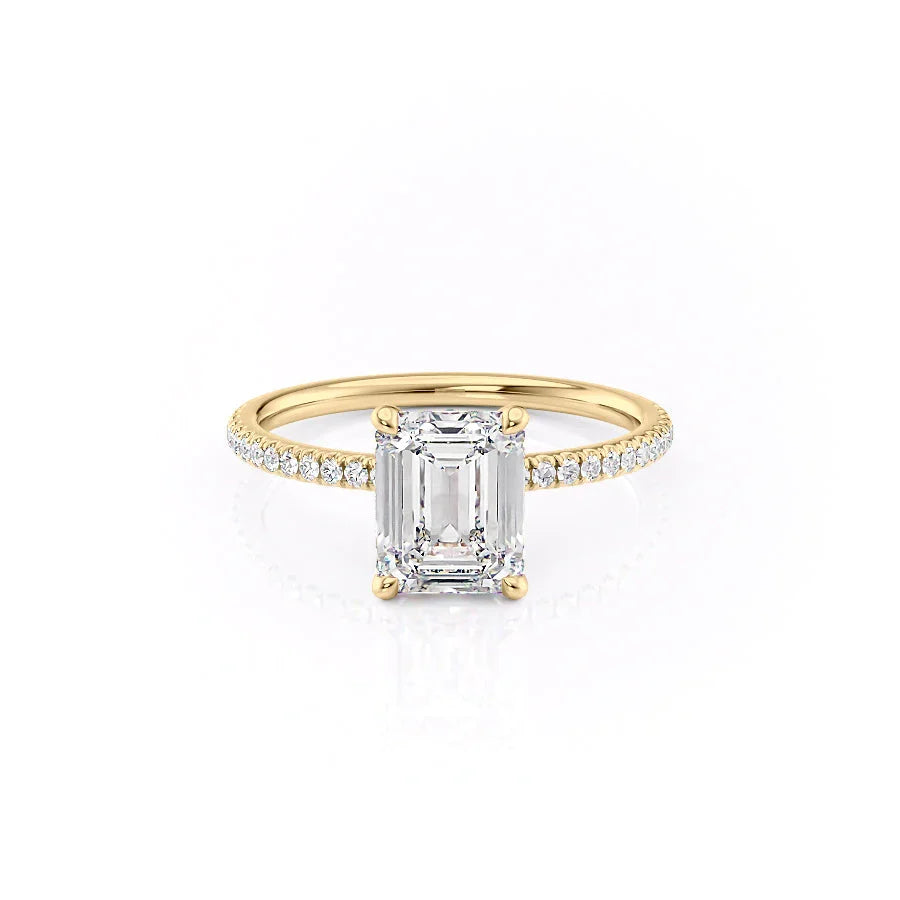 The Pave Nelly. A Yellow Gold Hidden Halo Engagement Ring Set With A 2ct Emerald Lab Grown Diamond. White Background.