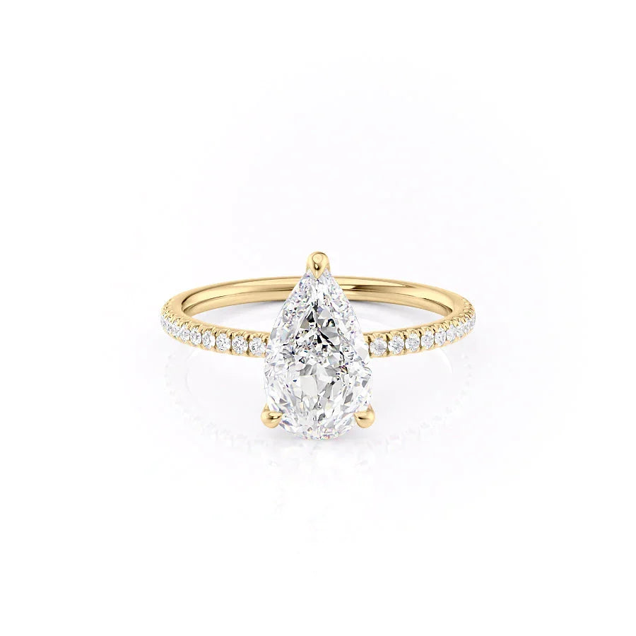 The Pave Nelly. A Yellow Gold Hidden Halo Engagement Ring Set With A 2ct Pear Lab Grown Diamond. White Background.