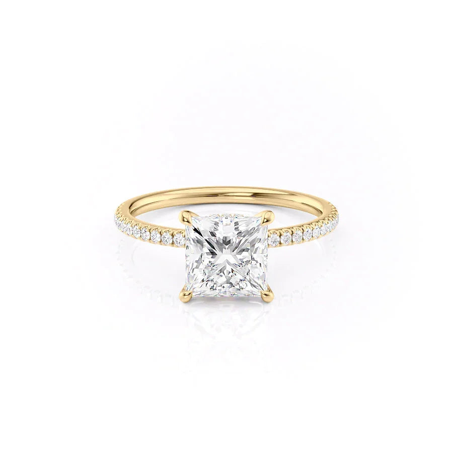 The Pave Nelly. A Yellow Gold Hidden Halo Engagement Ring Set With A 2ct Princess Lab Grown Diamond. White Background.