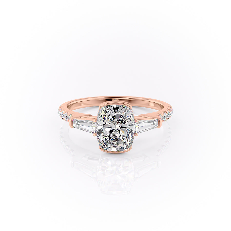 The Pave Parker. A Rose Gold Three Stone, Bezel Engagement Ring Set With A 2ct Elongated Cushion Lab Grown Diamond. White Background.