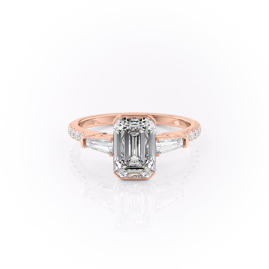 The Pave Parker. A Rose Gold Three Stone, Bezel Engagement Ring Set With A 2ct Emerald Lab Grown Diamond. White Background.