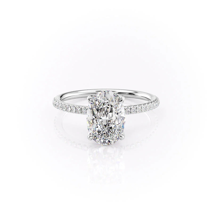 The Pave Petal Kamellie. A White Gold Nature Engagement Ring Set With A 2ct Oval Lab Grown Diamond. White Background.