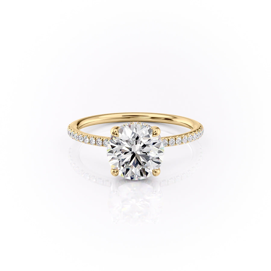 The Pave Sarah. A Yellow Gold Hidden Halo Engagement Ring Set With A 2ct Round Lab Grown Diamond. White Background.