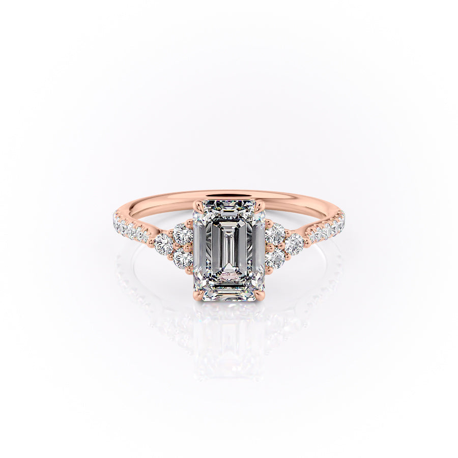 The Pave Scarlett. A Rose Gold Three Stone, Side Stones Engagement Ring Set With A 2ct Emerald Lab Grown Diamond. White Background.