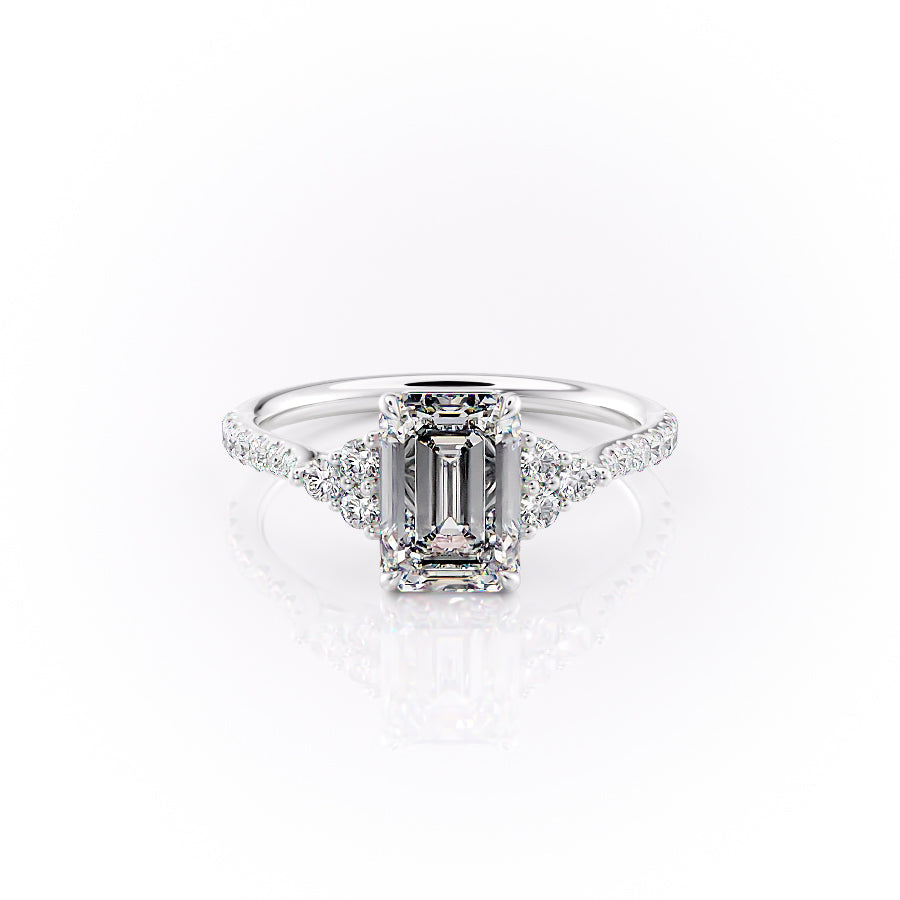 The Pave Scarlett. A White Gold Three Stone, Side Stones Engagement Ring Set With A 2ct Emerald Lab Grown Diamond. White Background.