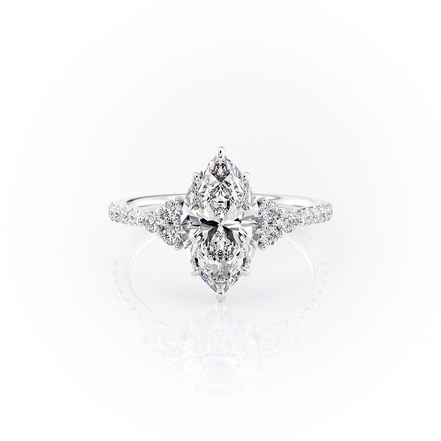 The Pave Scarlett. A White Gold Three Stone, Side Stones Engagement Ring Set With A 2ct Marquise Lab Grown Diamond. White Background.