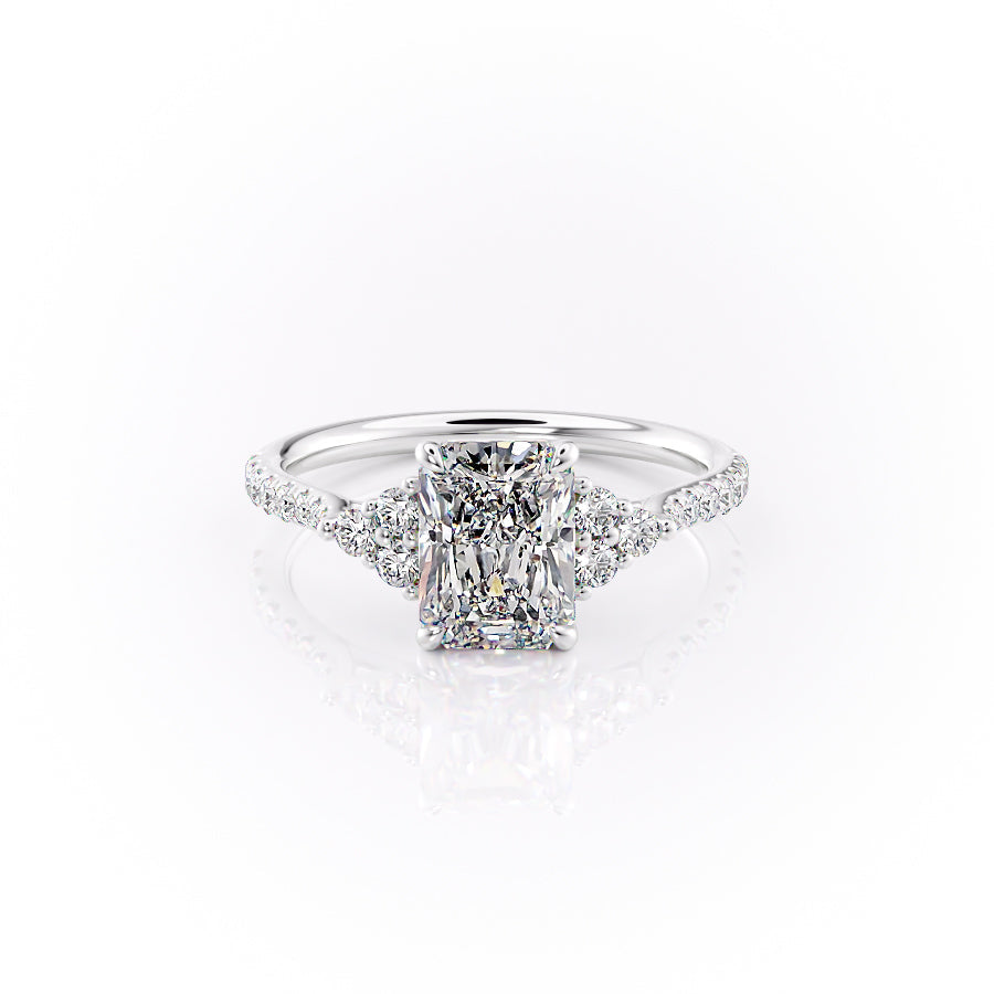 The Pave Scarlett. A White Gold Three Stone, Side Stones Engagement Ring Set With A 2ct Radiant Lab Grown Diamond. White Background.