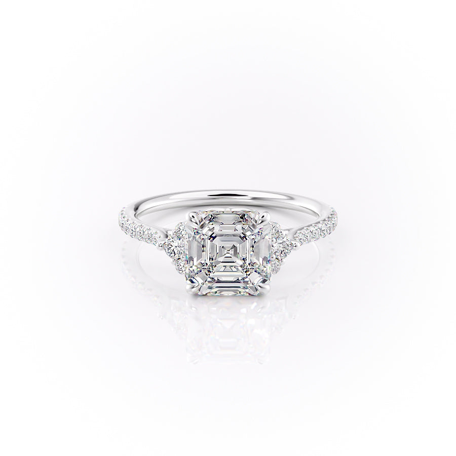 The Pave Victoria. A White Gold Three Stone, Side Stones Engagement Ring Set With A 2ct Asscher Lab Grown Diamond. White Background.