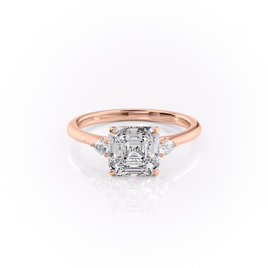 The Pears Liv. A Rose Gold Three Stone Engagement Ring Set With A 2ct Asscher Lab Grown Diamond. White Background.