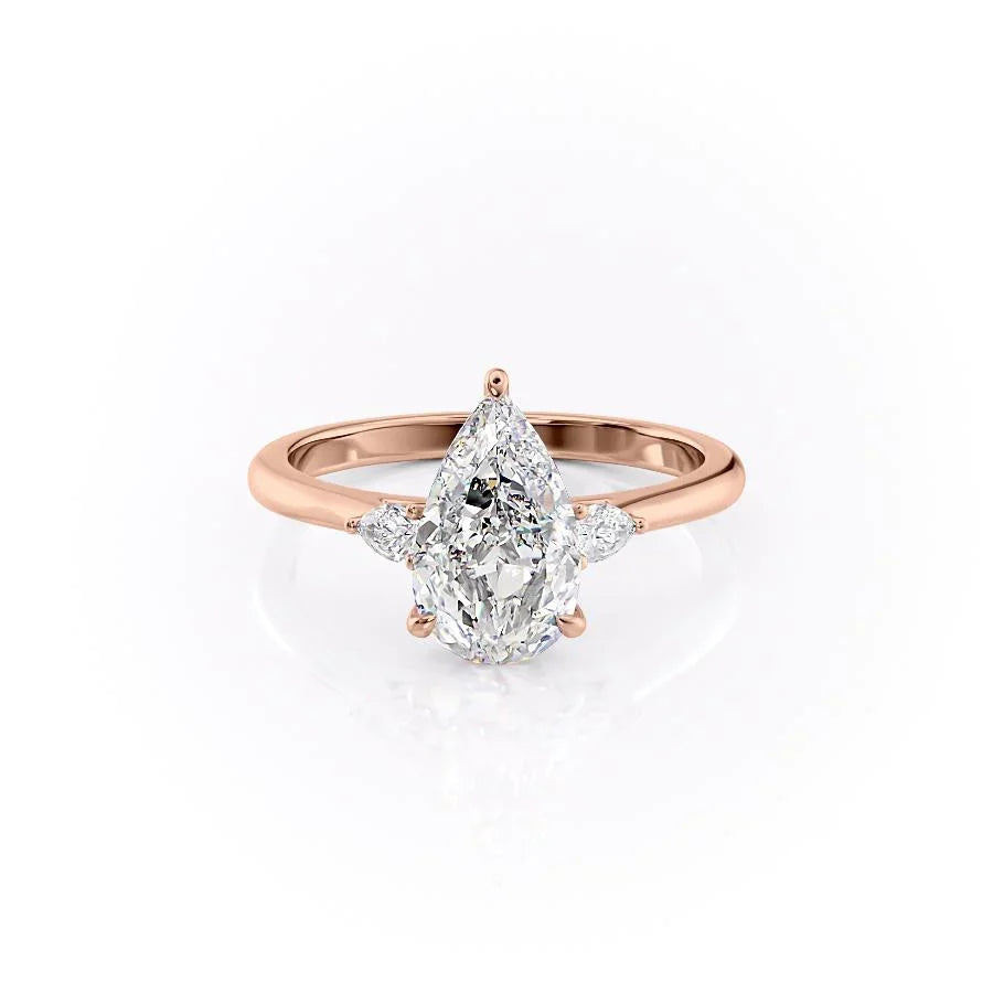 The Pears Liv. A Rose Gold Three Stone Engagement Ring Set With A 2ct Pear Lab Grown Diamond. White Background.