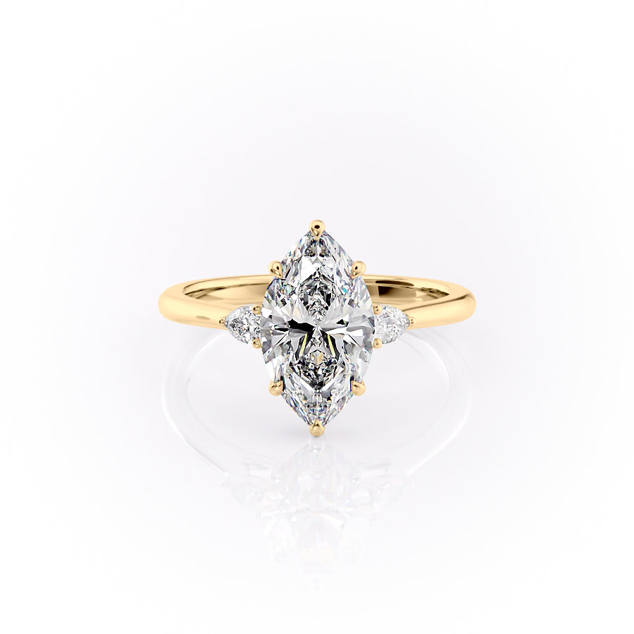 The Pears Liv. A Yellow Gold Three Stone Engagement Ring Set With A 2ct Marquise Lab Grown Diamond. White Background.