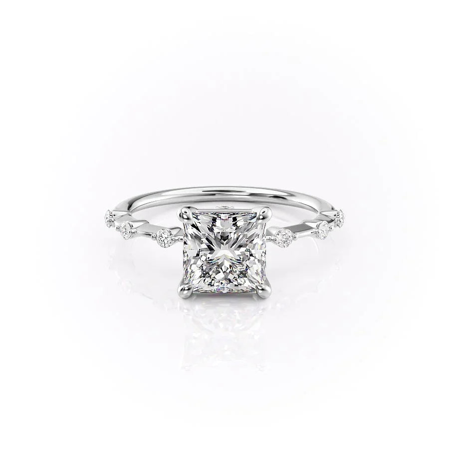 The Penelope. A White Gold Solitaire, Side Stones Engagement Ring Set With A 2ct Princess Lab Grown Diamond. White Background.