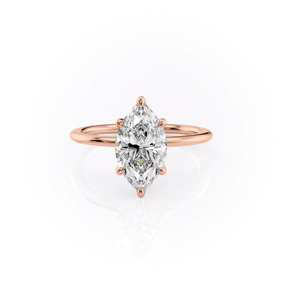 The Petal Kamellie. A Rose Gold Solitaire, Nature Engagement Ring Set With A 2ct Marquise Lab Grown Diamond. White Background.