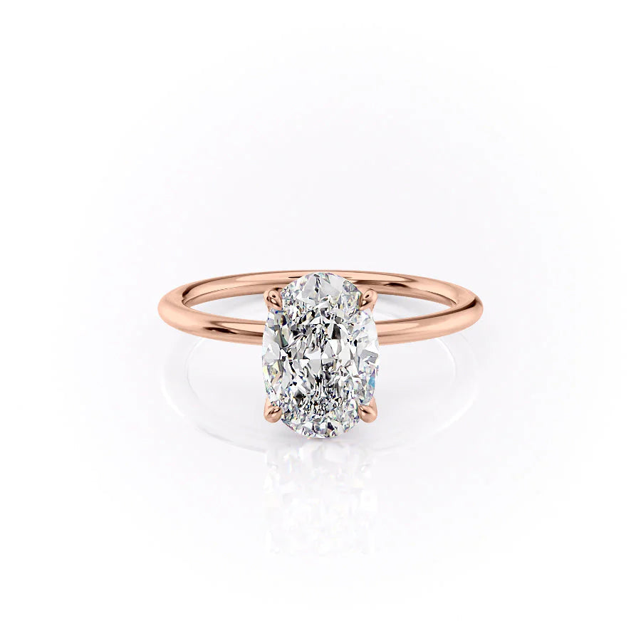 The Petal Kamellie. A Rose Gold Solitaire, Nature Engagement Ring Set With A 2ct Oval Lab Grown Diamond. White Background.