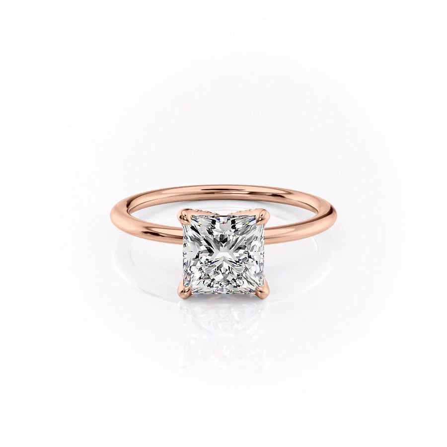 The Petal Kamellie. A Rose Gold Solitaire, Nature Engagement Ring Set With A 2ct Princess Lab Grown Diamond. White Background.