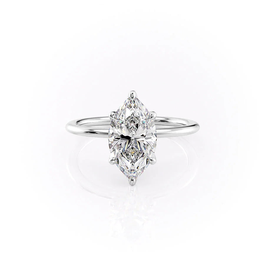 The Petal Kamellie. A White Gold Solitaire, Nature Engagement Ring Set With A 2ct Marquise Lab Grown Diamond. White Background.