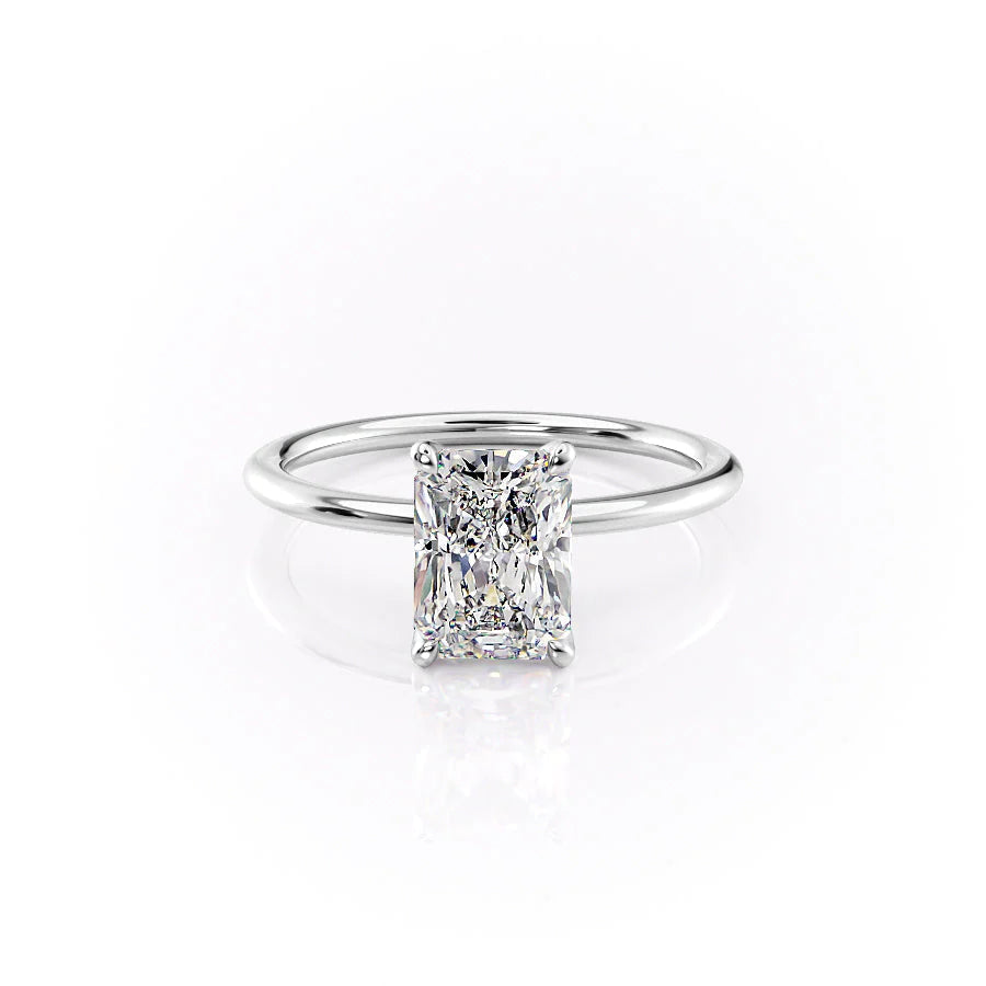 The Petal Kamellie. A White Gold Solitaire, Nature Engagement Ring Set With A 2ct Radiant Lab Grown Diamond. White Background.