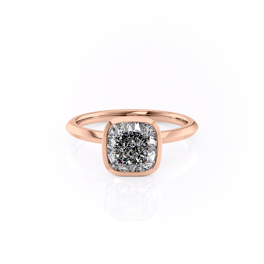 The Razor Bezel Kamellie. A Rose Gold Solitaire Engagement Ring Set With A 2ct Cushion Lab Grown Diamond. White Background.