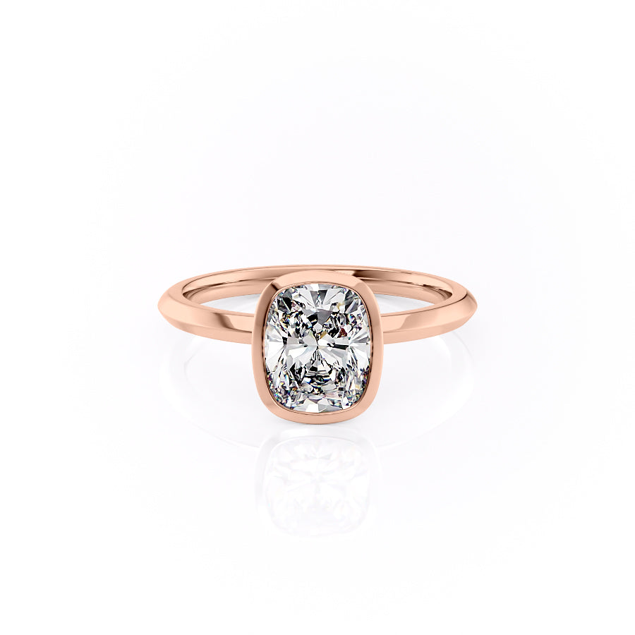 The Razor Bezel Kamellie. A Rose Gold Solitaire Engagement Ring Set With A 2ct Elongated Cushion Lab Grown Diamond. White Background.