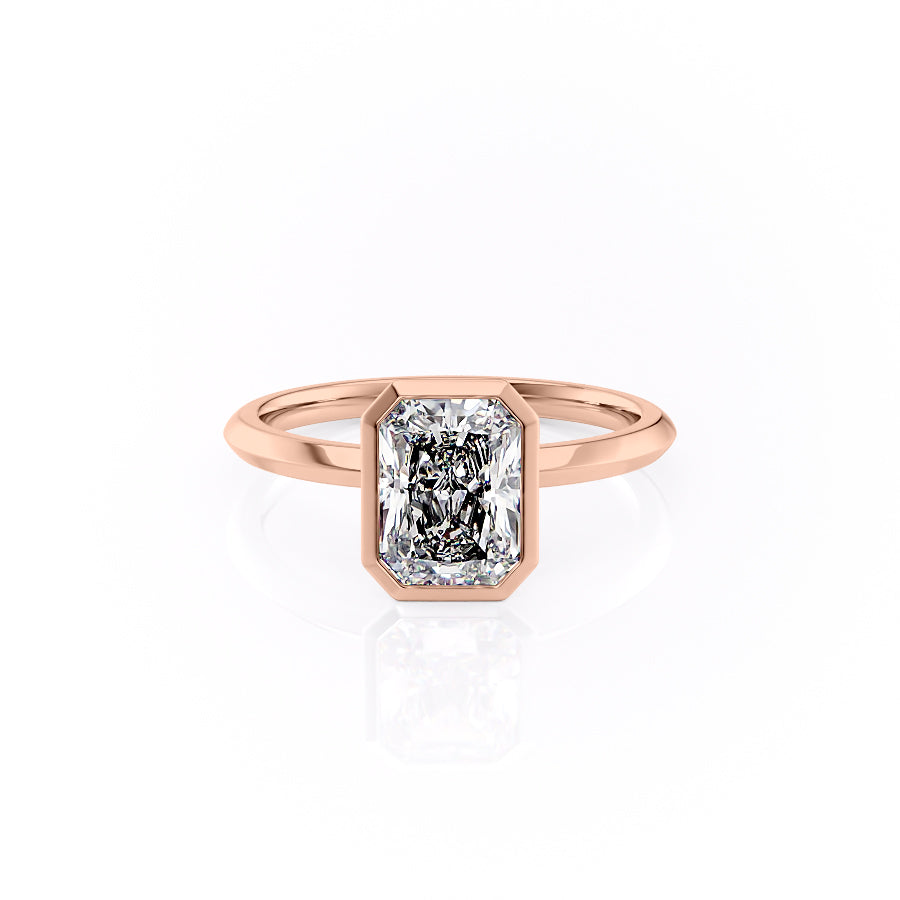 The Razor Bezel Kamellie. A Rose Gold Solitaire Engagement Ring Set With A 2ct Radiant Lab Grown Diamond. White Background.