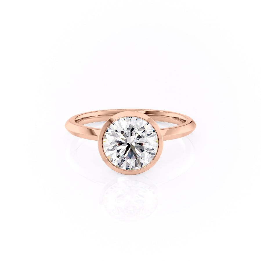 The Razor Bezel Kamellie. A Rose Gold Solitaire Engagement Ring Set With A 2ct Round Lab Grown Diamond. White Background.