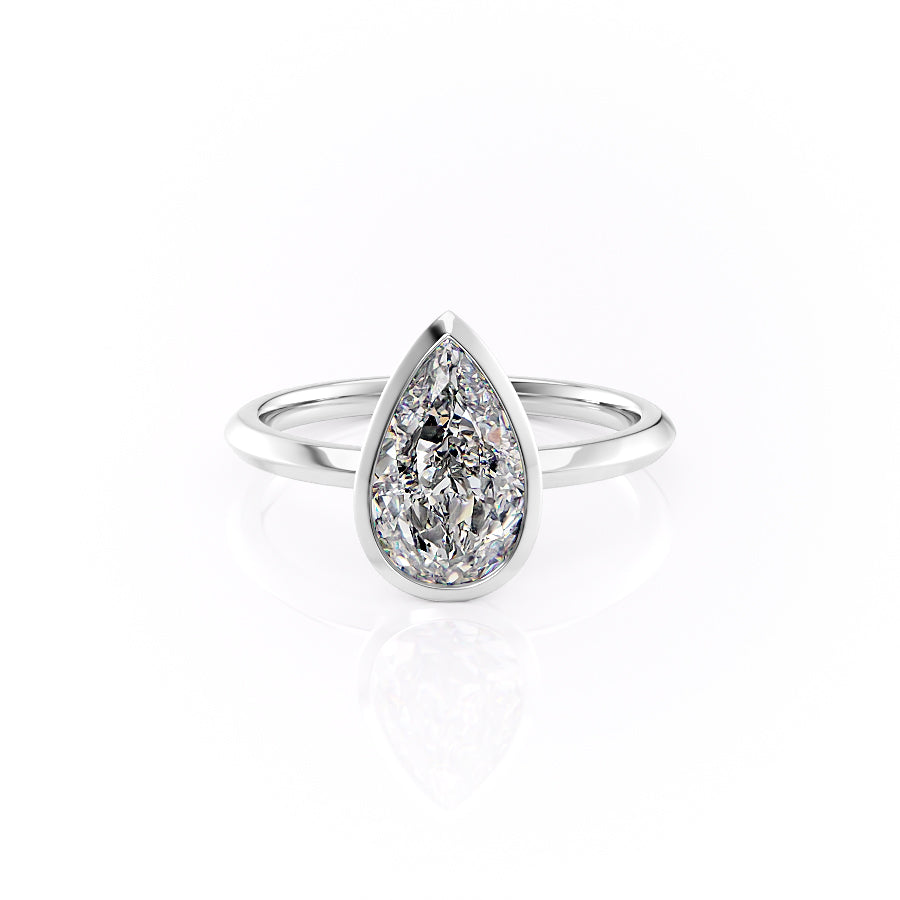 The Razor Bezel Kamellie. A White Gold Solitaire Engagement Ring Set With A 2ct Pear Lab Grown Diamond. White Background.