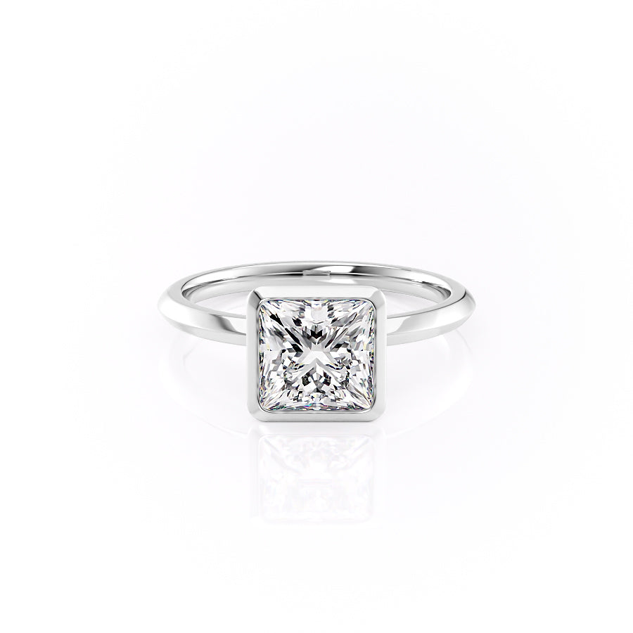 The Razor Bezel Kamellie. A White Gold Solitaire Engagement Ring Set With A 2ct Princess Lab Grown Diamond. White Background.