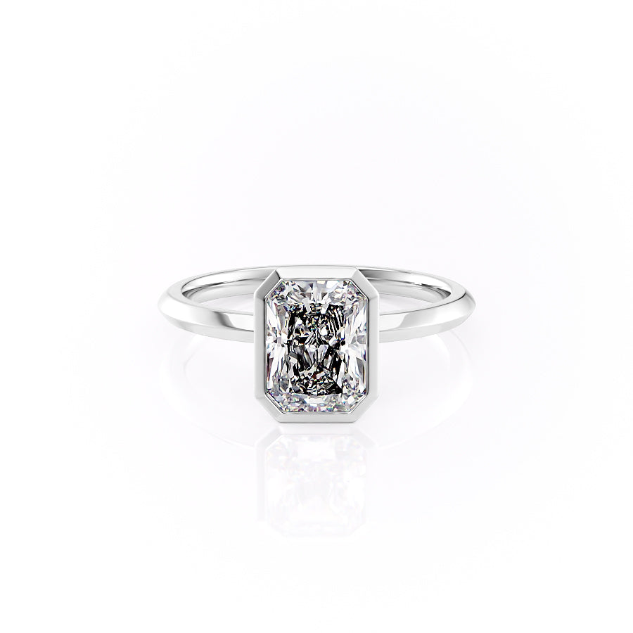 The Razor Bezel Kamellie. A White Gold Solitaire Engagement Ring Set With A 2ct Radiant Lab Grown Diamond. White Background.