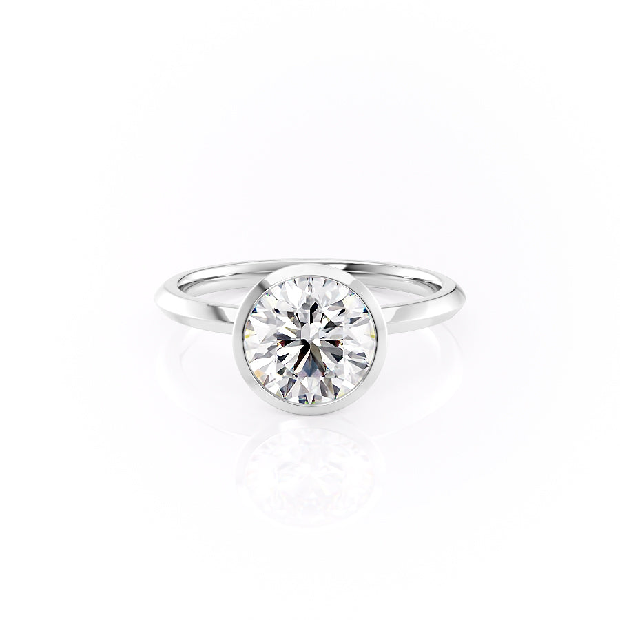 The Razor Bezel Kamellie. A White Gold Solitaire Engagement Ring Set With A 2ct Round Lab Grown Diamond. White Background.