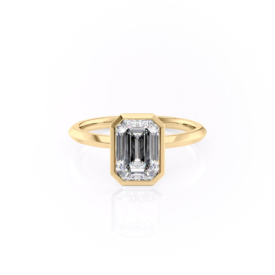 The Razor Bezel Kamellie. A Yellow Gold Solitaire Engagement Ring Set With A 2ct Emerald Lab Grown Diamond. White Background.