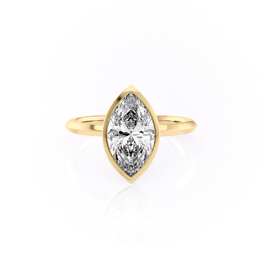 The Razor Bezel Kamellie. A Yellow Gold Solitaire Engagement Ring Set With A 2ct Marquise Lab Grown Diamond. White Background.