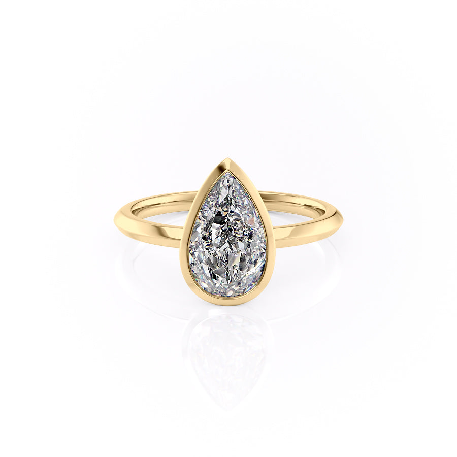 The Razor Bezel Kamellie. A Yellow Gold Solitaire Engagement Ring Set With A 2ct Pear Lab Grown Diamond. White Background.