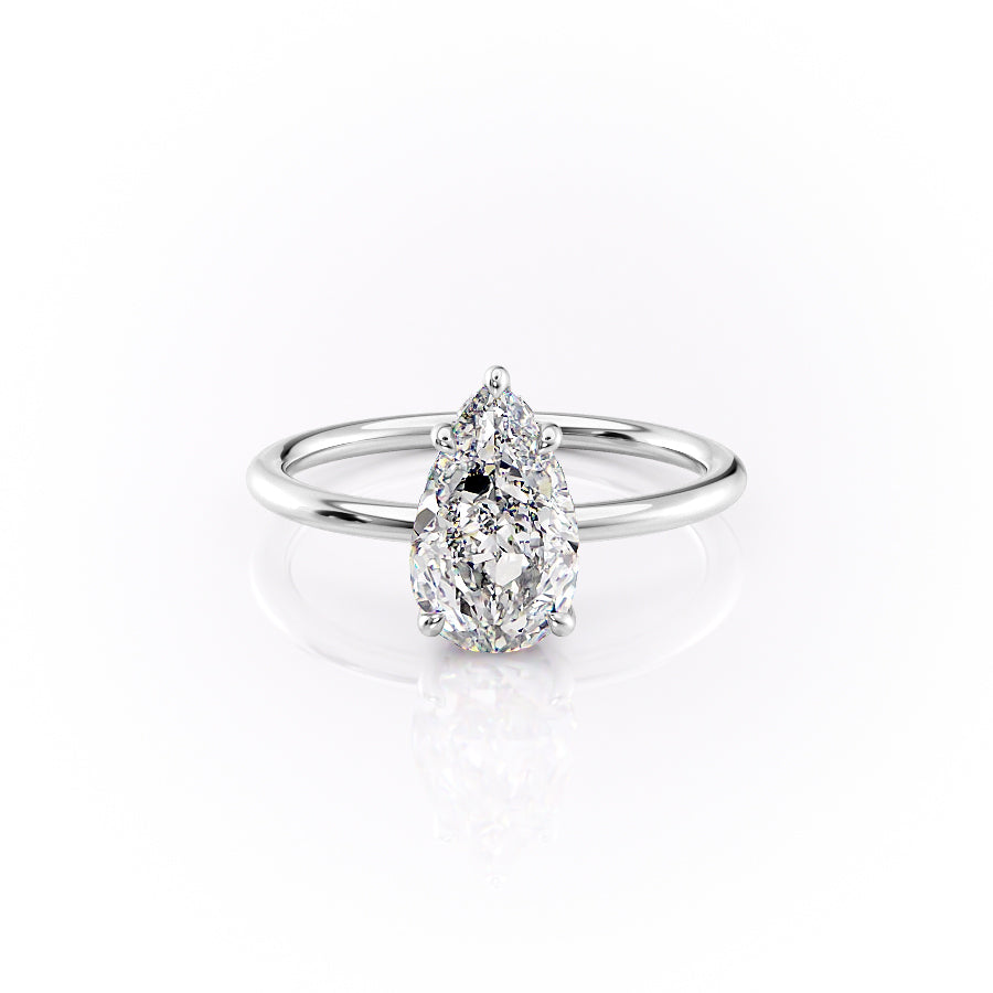 The Sandra. A White Gold Solitaire, Hidden Halo Engagement Ring Set With A 2ct Pear Lab Grown Diamond. White Background.