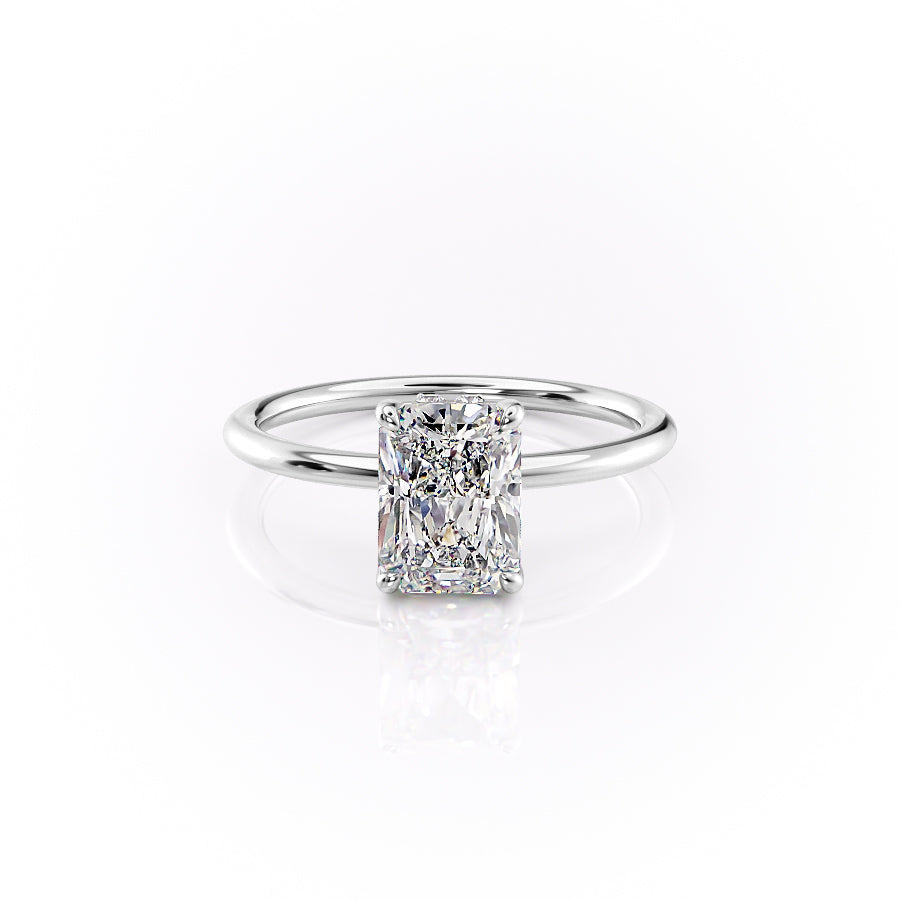The Sandra. A White Gold Solitaire, Hidden Halo Engagement Ring Set With A 2ct Radiant Lab Grown Diamond. White Background.