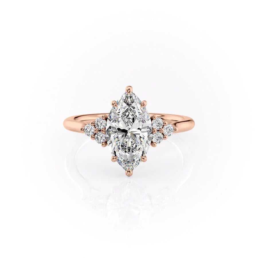The Scarlett. A Rose Gold Side Stones, Three Stone Engagement Ring Set With A 2ct Marquise Lab Grown Diamond. White Background.