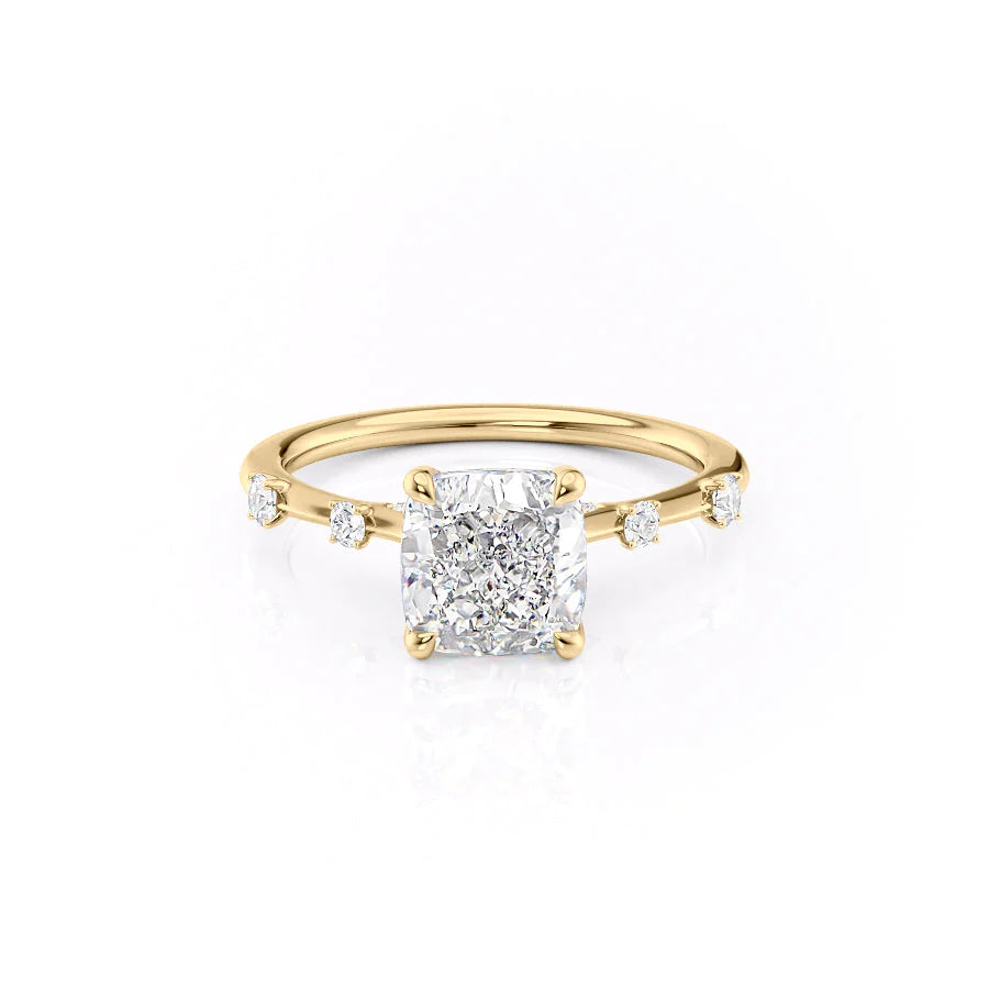 The Serena. A Yellow Gold Side Stones Engagement Ring Set With A 2ct Cushion Lab Grown Diamond. White Background.