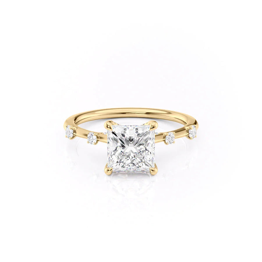 The Serena. A Yellow Gold Side Stones Engagement Ring Set With A 2ct Princess Lab Grown Diamond. White Background.