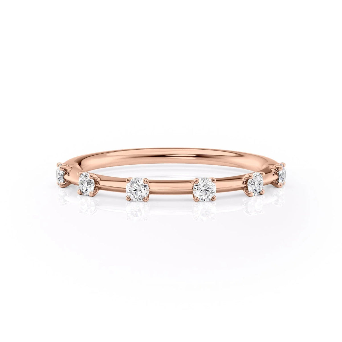 The Serena. A Rose Gold Prong Wedding Band Set With 0.2tcw Round Lab Grown Diamonds. White Background.