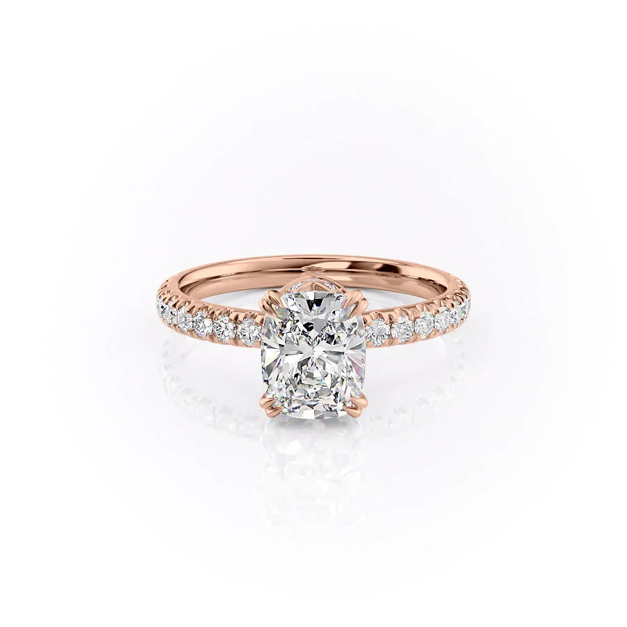 The Sofia. A Rose Gold Pave, Hidden Halo Engagement Ring Set With A 2ct Elongated Cushion Lab Grown Diamond. White Background.